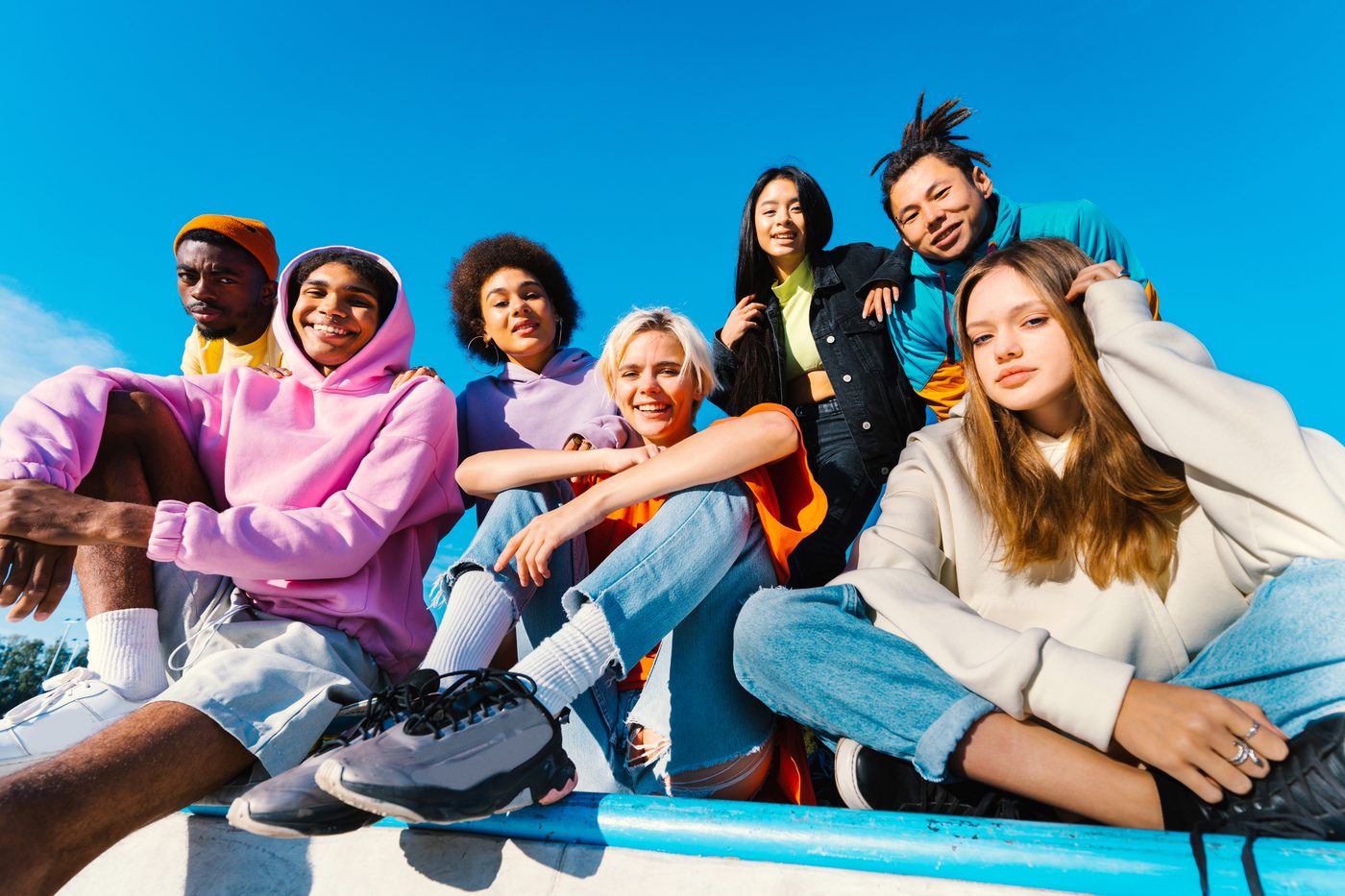 A group of seven young learners of different backgrounds sitting together